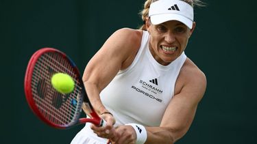 Germany's Angelique Kerber returns against Kazakhstan's Yulia Putintseva during their women's singles tennis match on the second day of the 2024 Wimbledon Championships at The All England Lawn Tennis and Croquet Club in Wimbledon, southwest London, on July 2, 2024. 
HENRY NICHOLLS / AFP