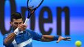 Serbia's Novak Djokovic hits a return to Italy's Matteo Berettini during their men's singles match at the ATP Qatar Open tennis tournament in Doha on February 18, 2025. 
Mahmud HAMS / AFP