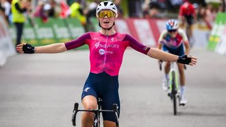 epa10863733 The winner of the stage Demi Vollering from Netherlands of team SD Worx celebrates as she crosses the finish line during the second stage, a 110,8 km race between Romont and Torgon at the women's Tour de Romandie Feminin UCI World Tour cycling race in Torgon, Switzerland, 16 September 2023.  EPA/JEAN-CHRISTOPHE BOTT