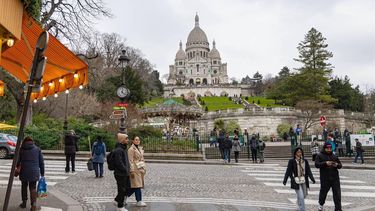 epa11882039 People stroll near the Sacre-Coeur Basilica in the Butte Montmartre neighbourhood in Paris, France, 07 February 2025 (issued 08 February 2025). Traffic restrictions, by making the streets more pedestrian-friendly, will be implemented by the City of Paris in the tourist destination of the upper Montmartre area of the city. The project intends to enhance the standard of living for locals in the popular area of Paris, which is home to famous sites like the Sacre-Coeur Basilica, the Place du Tertre, and the street where Picasso had his first Parisian studio.  EPA/CHRISTOPHE PETIT TESSON