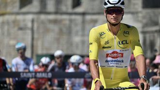 Alpecin - Deceuninck team's Dutch rider Mathieu van der Poel wearing the overall leader's yellow jersey awaits the start of the 7th stage of the 112th edition of the Tour de France cycling race, 197 km between Saint-Malo and Mur-de-Bretagne Guerledan, in Brittany, western France, on July 11, 2025. 
Marco BERTORELLO / AFP