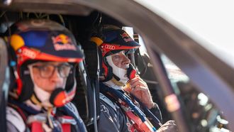 epa11085357 Carlos Sainz (R) and co-driver Lucas Cruz of Spain drive their Audi RS Q E-Tron E2 during Stage 10 of the 2024 Rally Dakar, in Al-Ula, Saudi Arabia, 17 January 2024.  EPA/Andew Eaton