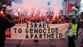 epa12446838 Protesters wave Palestinian flags and hold flares as they gather ahead of the World Cup qualifying match between Norway and Israel, in Oslo, Norway, 11 October 2025. Protesters rallied in solidarity and support for the Palestinians in the Gaza Strip.  EPA/Javad Parsa  NORWAY OUT