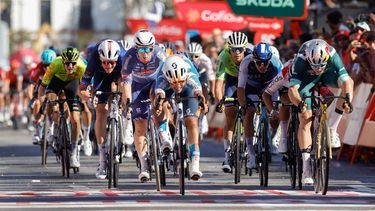 epa11558087 Czech DSM team cyclist Pavel Bittner (C) wins the fifth stage of the La Vuelta a Espana cycling race, over 177 km from Fuente del Maestre to Seville, Spain, 21 August 2024.  EPA/JAVIER LIZON