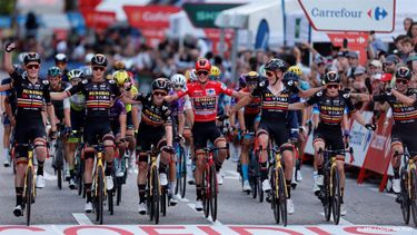 2023-09-17 20:14:43 Overall leader Team Jumbo-Visma's US rider Sepp Kuss (C) celebrates with teammates winning while crossing the finish line of the 21st and last stage of the 2023 La Vuelta cycling tour of Spain, a 101,1 km race between the hippodrome of La Zarzuela and Madrid, on September 17, 2023. American rider Sepp Kuss claimed his first Grand Tour victory in the Vuelta a Espana in Madrid, as his team Jumbo-Visma completed an unprecedented treble.

Oscar DEL POZO / AFP