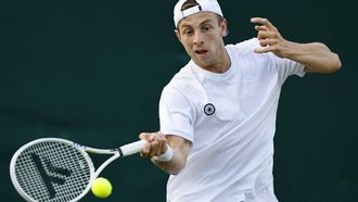 2023-07-05 19:53:07 epa10728399 Tallon Griekspoor of the Netherlands plays Marton Fucsovics of Hungary in their Men's Singles 1st round match at the Wimbledon Championships, Wimbledon, Britain, 05 July 2023.  EPA/TOLGA AKMEN   EDITORIAL USE ONLY