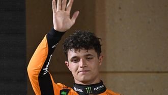 McLaren's British driver Lando Norris stands on the podium after the Bahrain Formula One Grand Prix at the Bahrain International Circuit in Sakhir on April 13, 2025. 
Andrej ISAKOVIC / AFP