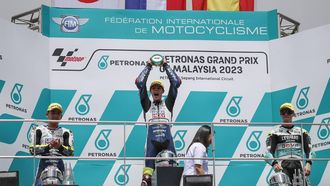 2023-11-12 12:49:14 epa10971106 Winner, Dutch Moto3 rider Collin Veijer (C) of Liqui Moly Husqvarna Intact GP, second-place Japanese Moto3 rider Ayumi Sasaki (L) of Liqui Moly Husqvarna Intact GP and third-placed Spanish Moto3 rider Jaume Masia (R) of Leopard Racing celebrate after the Moto3 class race of the Malaysia Motorcycling Grand Prix 2023 at the Petronas Sepang International Circuit, in Sepang, Malaysia, 12 November 2023.  EPA/FAZRY ISMAIL