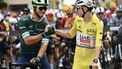 Lidl - Trek team's Italian rider Jonathan Milan wearing the best sprinter's green jersey shakes hands with UAE Team Emirates - XRG team's Slovenian rider Tadej Pogacar wearing the overall leader's yellow jersey at the start of the 10th stage of the 112th edition of the Tour de France cycling race, 165.3 km between Ennezat and Le Mont-Dore Puy de Sancy, in central France, on July 14, 2025. 
Marco BERTORELLO / AFP