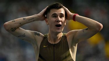 Norway's Jakob Ingebrigtsen reacts after setting a new world record in the men's 3000m event of the Silesia Diamond League athletics meeting in Chorzow, Poland, on August 25, 2024. 
Sergei GAPON / AFP