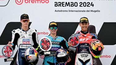 (LtoR) Netherlands' Liqui Moly Husqvarna Intact GP rider #95 Collin Veijer and Colombia's CFMOTO Aspar Team rider #80 David Alonso and Japan’s MT Helmets rider #06 Ryusei Yamanaka celebrate on the podium of the Italian Moto 3 race at Mugello on June 2, 2024. 
Marco BERTORELLO / AFP