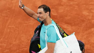 Spain's Rafael Nadal gestures to the public as he leaves the court after losing against Germany's Alexander Zverev in their men's singles match on Court Philippe-Chatrier on day two of The French Open tennis tournament at The Roland Garros Complex in Paris on May 27, 2024. 
Dimitar DILKOFF / AFP
