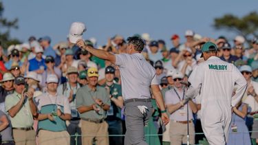 epa12881906 Rory McIlroy (L) of Northern Ireland walks off the green 18th hole with his caddie Harry Diamond (R) during the second round of the 2026 Masters Tournament at the Augusta National Golf Club in Augusta, Georgia, USA, 10 April 2026.  EPA/ERIK S. LESSER