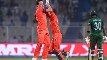 2023-10-28 17:15:11 Netherlands' Bas de Leede (L) celebrates with his captain Scott Edwards after taking the wicket of Bangladesh's Mahmudullah (R) during the 2023 ICC Men's Cricket World Cup one-day international (ODI) match between Netherlands and Bangladesh at the Eden Gardens in Kolkata on October 28, 2023. 
DIBYANGSHU SARKAR / AFP