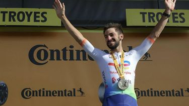 TotalEnergies team's French rider Anthony Turgis celebrates on the podium after winning the 9th stage of the 111th edition of the Tour de France cycling race, 199km stage departing and finishing in Troyes, on July 7, 2024. 
Thomas SAMSON / AFP