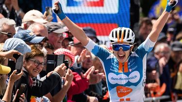 French dsm-firmenich PostNL team's cyclist Juliette Labous celebrates while crossing the finish line to win the Elit road women French championships cycling race, in Saint-Martin-de-Landelles, western France, on June 22, 2024.  
LOIC VENANCE / AFP