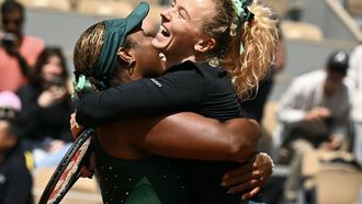 US Taylor Townsend (L) and Czech Republic's Katerina Siniakova celebrate their victory at the end of their women's doubles final match against Kazakhstan's Anna Danilina and Serbia's Aleksandra Krunic on day 15 of the French Open tennis tournament on Court Philippe-Chatrier at the Roland-Garros Complex in Paris on June 7, 2026. 
JULIEN DE ROSA / AFP