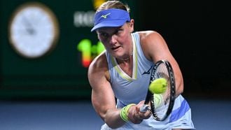 Netherlands' Suzan Lamens hits a return against Austria's Anastasia Potapova during their women's singles match on day one of the Australian Open tennis tournament in Melbourne on January 18, 2026. 
WILLIAM WEST / AFP