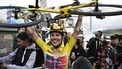 Canyon//SRAM Racing team's Polish rider Katarzyna Niewiadoma celebrates after crossing the finish line and winning the third edition of the Women's Tour de France cycling race, after the 8th and last stage of the Tour de France, a 149.9 km between Le Grand Bornand and the Alpe d'Huez, in south-eastern France, on August 18, 2024. 
JULIEN DE ROSA / AFP