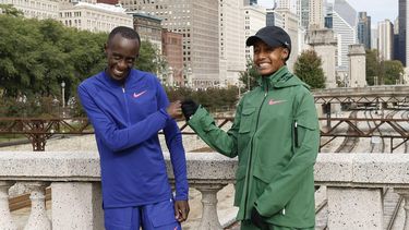 Sifan Hassan of the Netherlands and Kenya's Kelvin Kiptum pose after winning the 2023 Bank of America Chicago Marathon in Chicago, Illinois, on October 8, 2023.  Kiptum won in a world record time of two hours and 35 seconds while Hassan won the Chicago Marathon women's title on Sunday in an unofficial time of two hours, 13 minutes and 44 seconds -- the second-fastest women's time in marathon history.
KAMIL KRZACZYNSKI / AFP