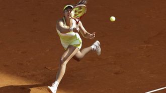epa12908991 Petra Marcinko of Croatia in action against Belinda Bencic of Switzerland in their women's singles round of 64 game during the Madrid Open tennis tournament at Caja Magica tennis complex in Madrid, Spain, 23 April 2026.  EPA/Chema Moya