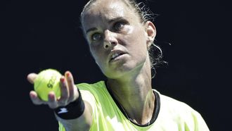 epa11821063 Arantxa Rus of Netherlands serves during the Women's Singles first round match against Olga Danilovic of Serbia at the Australian Open tennis tournament in Melbourne, Australia, 13 January 2025.  EPA/ROLEX DELA PENA