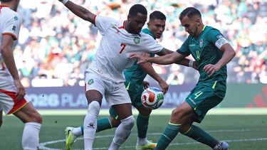 Suriname's forward #07 Gyrano Kerk and Bolivia's defender #04 Luis Haquin fight for the ball during the 2026 FIFA World Cup qualifiers semi-final playoff football match between Bolivia and Suriname at the BBVA Stadium in Guadalupe, Mexico on March 26, 2026. 
Julio Cesar AGUILAR / AFP