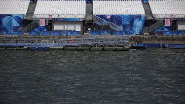 This photograph shows empty stands on the banks of the Seine river, after the first triathlon training session was cancelled during the Paris 2024 Olympic Games in Paris, on July 28, 2024, due to the pollution of the Seine river. The improved weather failed to prevent the first triathlon training session in the River Seine from being cancelled on July 28, 2024. Following a meeting 