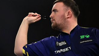 England's Luke Littler plays against England's Stephen Bunting during their PDC World Darts Championship semi-final at Alexandra Palace in London on January 2, 2025. 
Ben STANSALL / AFP