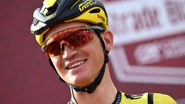 US Sepp Kuss, team Visma stands on stage before the start of the 18th one-day classic 'Strade Bianche' (White Roads) cycling race between Siena and Siena, Tuscany, on March 2, 2024. 
Marco BERTORELLO / AFP