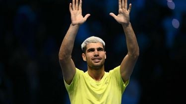 Spain's Carlos Alcaraz celebrates after winning against Italy's Lorenzo Musetti at the ATP Finals tennis tournament in Turin on November 13, 2025. Carlos Alcaraz will end the year as world number one after beating Lorenzo Musetti at the ATP Finals 6-4, 6-1 today.
Marco BERTORELLO / AFP