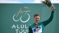 Dutch Casper van Uden (DSM-Firmenich PostNL), first at the general classification, holds flowers on the podium after the third stage between Al-Ula International Airport and Al-Ula Camel Cup Track, during the Al-Ula Tour cycling race at Al-Ula Camel Cup Track on February 1, 2024. 
Anne-Christine POUJOULAT / AFP