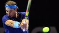 Spain's Rafael Nadal hits a return to Serbia's Novak Djokovic during their third-place tennis match in the 