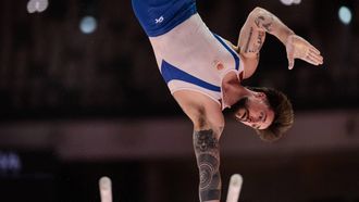 Netherlands' Casimir Schmidt competes on the parallel bars during the men's qualifying session at the 53rd FIG Artistic Gymnastics World Championships In Jakarta on October 19, 2025. 
 
Yasuyoshi CHIBA / AFP