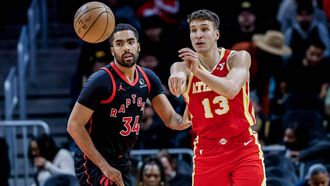 epa11111754 Atlanta Hawks guard Bogdan Bogdanovic (R) of Serbia in action against Toronto Raptors center Jontay Porter (L) during the first half of the NBA basketball game between the Toronto Raptors and the Atlanta Hawks in Atlanta, Georgia, USA, 28 January 2024.  EPA/ERIK S. LESSER  SHUTTERSTOCK OUT