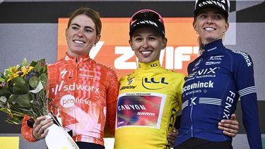 (From L) Stage winner and second placed Team SD Worx - Protime's Dutch rider Demi Vollering, Overalll leader and first placed Canyon//SRAM Racing team's Polish rider Katarzyna Niewiadoma wearing the overall leader's yellow jersey and third placed Fenix-Deceuninck team's Dutch rider Pauliena Rooijakkers celebrate on the podium after competing in the 8th and last stage of the third edition of the Women's Tour de France cycling race, a 149.9 km between Le Grand Bornand and the Alpe d'Huez, in L'Alpe d'Huez, south-eastern France, on August 18, 2024. 
JULIEN DE ROSA / AFP
