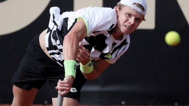 epa09542298 Dutch tennis player Jesper de Jong returns a ball to the Argentine Facundo Mena, during a match for the semifinals of the ATP Tennis Challenger tournament, at the Carmel Club in Bogota, Colombia, 23 October 2021.  EPA/Carlos Ortega