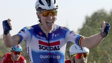 Belgium's Tim Merlier of Soudal Quick-Step celebrates as he crosses the finish line to win stage 1 of the 6th UAE Tour 2024, from Al Dhafra Walk to Liwa, on February 19, 2024. 
Giuseppe CACACE / AFP