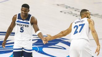epa11376590 Minnesota Timberwolves forward Anthony Edwards (L) gives a high five to Minnesota Timberwolves center Rudy Gobert (R) during the first half of the NBA Western Conference Finals playoff game four between the Minnesota Timberwolves and the Dallas Mavericks in Dallas, Texas, USA, 28 May 2024.  EPA/ADAM DAVIS SHUTTERSTOCK OUT