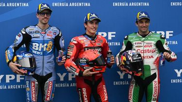 (L to R) BK8 Gresini Racing MotoGP's Spanish rider Alex Marquez, Ducati Lenovo's Spanish rider Marc Marquez, and LCR Honda's French rider Johann Zarco celebrate their second, first, and third place respectively in the MotoGP Argentina Grand Prix qualifying session at the Termas de Rio Hondo circuit in Santiago del Estero, Argentina on March 15, 2025. 
Luis ROBAYO / AFP