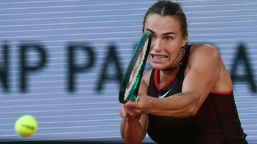 Aryna Sabalenka plays a backhand return to France's Elsa Jacquemot during their women's singles match on day 5 of the French Open tennis tournament on Court Philippe-Chatrier at the Roland-Garros Complex in Paris on May 28, 2026. 
ALAIN JOCARD / AFP