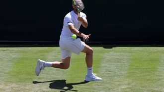 2023-07-07 13:57:13 France's Adrian Mannarino returns the ball to Russia's Daniil Medvedev during their men's singles tennis match on the fifth day of the 2023 Wimbledon Championships at The All England Tennis Club in Wimbledon, southwest London, on July 7, 2023.  
Adrian DENNIS / AFP