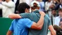 Italy's Jannik Sinner (R) embraces with Spain's Carlos Alcaraz after winning the Monte Carlo ATP Masters Series Tournament final tennis match on Court Rainier III at the Monte-Carlo Country Club in Roquebrune-Cap-Martin, south-eastern France on April 12, 2026. 
Valery HACHE / AFP