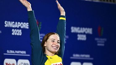 Gold medallist Australia's swimmer Mollie O'Callaghan celebrates on the podium of the women's 200m freestyle swimming event during the 2025 World Aquatics Championships in Singapore on July 30, 2025.  
MANAN VATSYAYANA / AFP