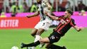 Juventus' Brazilian defender #03 Bremer (L) fights for the ball with AC Milan's French midfielder #12 Adrien Rabiot during the Italian Serie A football match between AC Milan and Juventus FC at the San Siro stadium in Milan, northern Italy, on April 26, 2026. 
Stefano RELLANDINI / AFP