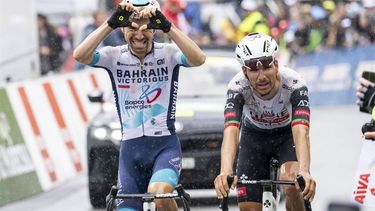 epa12071235 Lenny Martinez (L) from France of team Bahrain Victorius celebrates winning, past Joao Almeida from Portugal of UAE Team Emirates XRG, the fourth stage, a 118,2 km race between Sion and Thyon 2000 at the 78th Tour de Romandie UCI World Tour Cycling race, in Thyon, Switzerland, 03 May 2025.  EPA/JEAN-CHRISTOPHE BOTT