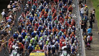 epa11475596 Riders in action at Pau during the neutralised start of the 14th stage of the 2024 Tour de France cycling race over 151km from Pau to Saint-Lary-Soulan Pla d'Adet, France, 13 July 2024.  EPA/GUILLAUME HORCAJUELO