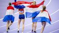PARIJS - Lieke Klaver, Cathelijn Peeters, Lisanne de Witte en Femke Bol reageren na het winnen van de zilveren medaille op de 4 x 400m estafette (v) van het atletiek tijdens de Olympische Spelen. ANP ROBIN VAN LONKHUIJSEN