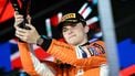 McLaren's Australian driver Oscar Piastri celebrates coming third place on the podium after the Formula One Singapore Grand Prix night race at the Marina Bay Street Circuit in Singapore on September 22, 2024. 
Lillian SUWANRUMPHA / AFP