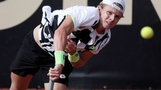 2021-10-23 21:32:18 epa09542298 Dutch tennis player Jesper de Jong returns a ball to the Argentine Facundo Mena, during a match for the semifinals of the ATP Tennis Challenger tournament, at the Carmel Club in Bogota, Colombia, 23 October 2021.  EPA/Carlos Ortega